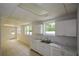 Basement features a sink with a countertop, cabinets, windows, and easy outdoor access at 871 Cowan Se Rd, Conyers, GA 30094