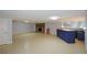 Spacious basement features a stone fireplace and a bar area for entertaining guests at 871 Cowan Se Rd, Conyers, GA 30094