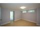 Finished basement with neutral paint, tiled flooring, and natural light from the windows at 871 Cowan Se Rd, Conyers, GA 30094