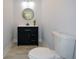 This powder room features a modern vanity, updated fixtures, and tile floors at 871 Cowan Se Rd, Conyers, GA 30094