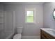 Updated bathroom featuring a tub, toilet, sink with modern finishes at 871 Cowan Se Rd, Conyers, GA 30094