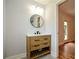 Bathroom vanity with shaker cabinets, round mirror, and modern fixtures at 871 Cowan Se Rd, Conyers, GA 30094
