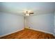 Spacious bedroom with hardwood flooring and a modern ceiling fan at 871 Cowan Se Rd, Conyers, GA 30094