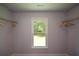 Bright closet space with wire shelving and a view from the window at 871 Cowan Se Rd, Conyers, GA 30094