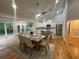 Bright dining area features hardwood floors, vaulted ceilings, and kitchen access at 871 Cowan Se Rd, Conyers, GA 30094