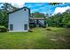 Exterior of the home highlighting the outdoor entertainment space; ideal for Gathering gatherings at 871 Cowan Se Rd, Conyers, GA 30094