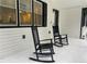Charming front porch with rocking chairs, perfect for relaxing outdoors at 871 Cowan Se Rd, Conyers, GA 30094
