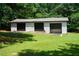 Three-car garage with a driveway; excellent for car enthusiasts or extra storage at 871 Cowan Se Rd, Conyers, GA 30094