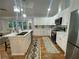 Bright and spacious kitchen with stainless steel appliances and island seating at 871 Cowan Se Rd, Conyers, GA 30094