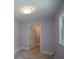 This well-lit laundry room boasts tile floors, modern lighting, and a window at 871 Cowan Se Rd, Conyers, GA 30094