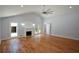 Bright living room features hardwood floors, a fireplace, and large windows offering lots of natural light at 871 Cowan Se Rd, Conyers, GA 30094