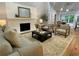 Inviting living room with a fireplace, comfortable seating and hardwood floors at 871 Cowan Se Rd, Conyers, GA 30094