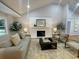 Bright living room features a white brick fireplace and neutral decor at 871 Cowan Se Rd, Conyers, GA 30094