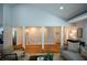 Cozy living room with hardwood floors, a vaulted ceiling, and neutral decor at 871 Cowan Se Rd, Conyers, GA 30094