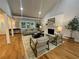 Open-concept living area with fireplace and hardwood floors at 871 Cowan Se Rd, Conyers, GA 30094
