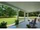 Relaxing front porch with rocking chairs and scenic views of the yard at 871 Cowan Se Rd, Conyers, GA 30094