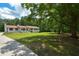 Expansive yard with mature trees offering shade and tranquility at 871 Cowan Se Rd, Conyers, GA 30094