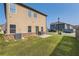 Well maintained backyard with green grass and a concrete patio with seating area at 11910 Brightside Pkwy, Hampton, GA 30228