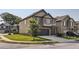 Attractive home featuring brick and siding exterior, a well-manicured lawn, and an attached two-car garage at 11910 Brightside Pkwy, Hampton, GA 30228