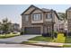 Charming two-story home with brick and siding, showcasing a well-maintained front yard and attached two-car garage at 11910 Brightside Pkwy, Hampton, GA 30228