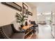 Inviting foyer featuring hardwood floors, stylish decor, and a glimpse into the spacious living area at 11910 Brightside Pkwy, Hampton, GA 30228