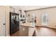 Bright kitchen with modern appliances, eat-in kitchen island and adjacent walk-out at 11910 Brightside Pkwy, Hampton, GA 30228