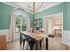 Dining room with large window and a trendy light fixture at 1865 Morgans Run Trl, Buford, GA 30519