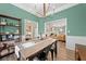 Dining room with stylish decor and views into the living area at 1865 Morgans Run Trl, Buford, GA 30519