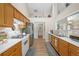 Efficient kitchen with white countertops, stainless steel appliances and wood cabinets at 1865 Morgans Run Trl, Buford, GA 30519