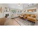 Open living room with fireplace, hardwood floors, and natural light at 1865 Morgans Run Trl, Buford, GA 30519