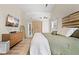 Comfortable main bedroom featuring vaulted ceilings, wood floors, neutral colors, and an ensuite at 1865 Morgans Run Trl, Buford, GA 30519