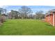 Expansive green backyard with lush lawn, perfect for outdoor activities and relaxation at 2649 Lake Harbin Rd, Morrow, GA 30260