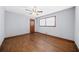 Clean bedroom with hardwood flooring, neutral paint, and a ceiling fan at 2649 Lake Harbin Rd, Morrow, GA 30260