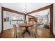 Open concept dining room with modern light fixture connecting to the kitchen and living area at 2649 Lake Harbin Rd, Morrow, GA 30260