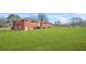 A spacious green lawn surrounds this brick home, offering plenty of outdoor space at 2649 Lake Harbin Rd, Morrow, GA 30260