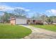 Charming single-story red brick home with attached garage and well-manicured lawn at 2649 Lake Harbin Rd, Morrow, GA 30260