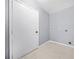 Laundry room with tile flooring, ample space for washer and dryer, with neutral wall paint at 2649 Lake Harbin Rd, Morrow, GA 30260