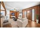 Inviting living room boasts wood paneling, fireplace, ceiling fan, and neutral decor at 2649 Lake Harbin Rd, Morrow, GA 30260