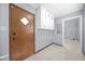 Mud room with tile flooring, storage cabinets, and access to laundry area at 2649 Lake Harbin Rd, Morrow, GA 30260