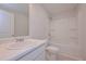 Bright bathroom featuring a bathtub with shower, white vanity and tile floors at 48 Beaver Pt, Villa Rica, GA 30180