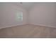 Cozy bedroom with plush carpeting, neutral paint, and window for natural light at 48 Beaver Pt, Villa Rica, GA 30180