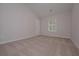 Spacious carpeted bedroom with neutral walls and natural light from window at 48 Beaver Pt, Villa Rica, GA 30180
