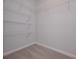 Walk-in closet with shelving installed and plush carpet at 48 Beaver Pt, Villa Rica, GA 30180