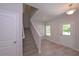 Open foyer featuring hardwood floors, a staircase, and entry to the front door at 48 Beaver Pt, Villa Rica, GA 30180