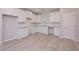 Well-lit kitchen featuring white cabinets, granite countertops, and modern finishes, including a sink at 48 Beaver Pt, Villa Rica, GA 30180