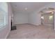 Bright living room with light wood floors, fireplace, and archway to the entryway at 48 Beaver Pt, Villa Rica, GA 30180
