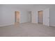 Large main bedroom featuring plush carpet and doors to ensuite and closet at 48 Beaver Pt, Villa Rica, GA 30180