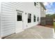 Back exterior of home with an outdoor patio, white siding, and green lawn at 105 Priestwood Ln, Acworth, GA 30102