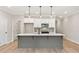Stylish kitchen with hardwood floors, a large island, and pendant lights at 105 Priestwood Ln, Acworth, GA 30102