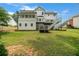 Well-maintained backyard featuring a deck and patio, perfect for relaxing and enjoying the outdoors at 340 Chandler Ct, Sugar Hill, GA 30518